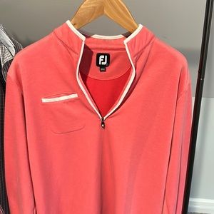 Foot joy pullover size large in pink with links of Novi embroidered logo.